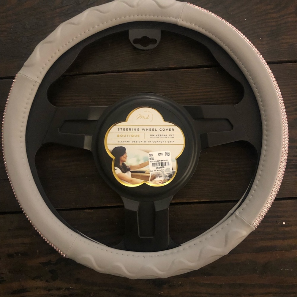 New steering wheel cover. Gray with pink diamonds.